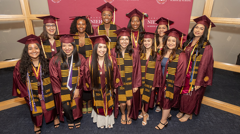 The first cohort of graduates in the Marcella Niehoff School of Nursing's CARE Pathway to the BSN